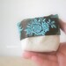 Mini canvas bucket with turquoise Chinese embroidery on brown fabric - Happiness