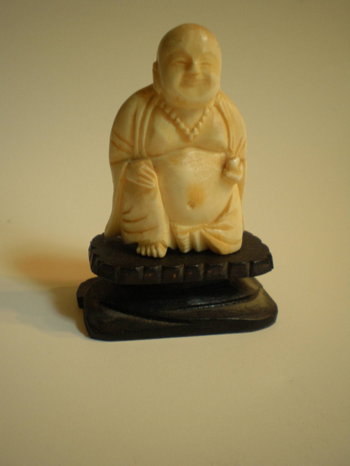 small carved ivory buddha