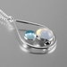 Sterling silver teardrop shape pendant necklace with blue topaz, hematite and opalite cabochons