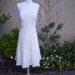 A vintage 1980s ivory beaded sheer sleeveless tulle cocktail wedding prom dress size M