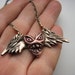 Heart wing monster pendant sculpture