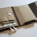 Nerd Herder odds and ends gadget wallet in Peanut Butter and Chocolate- iPod, Droid, Zune, MP3, metronome, digital camera, earbuds, SD cards, USB, extra batteries, guitar picks, IDs, credit cards, phone- one wallet holds whatever you want to round up.