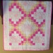 Crib size Irish chain Quilt featuring a toile nursery print in pink , yellow, and white