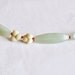 nO113 ivory flowers between aventurine and coral
