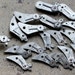 Vintage selection of clock parts -- balance cocks -- set of 19 -- D4