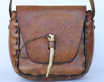 Nice Boho vintage hand made, hand tooled hippie leather shoulder bag, purse with an ivory pick...
