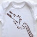 Giraffe Kisses (Chocolate on White Onesie) --6M Baby Bodysuit