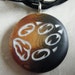 Fire FOX Paw Print hand carved on a on a two toned background. Pendant comes with a FREE 3mm leather necklace