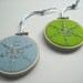 20% off Snowflake Ornaments - two hand embroidered snowflakes in 3 inch hoops. Baby Blue & Citrine