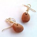 River rock and silver earrings