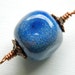 Blue Enameled Art Bead with Copper Bead Caps and Wire Wrapped Loops
