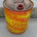metal gasoline can red and yellow 5 gallons rusty rustic photo prop great graphics