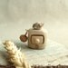 Miniature cabinet with a cute little bird, wood carving