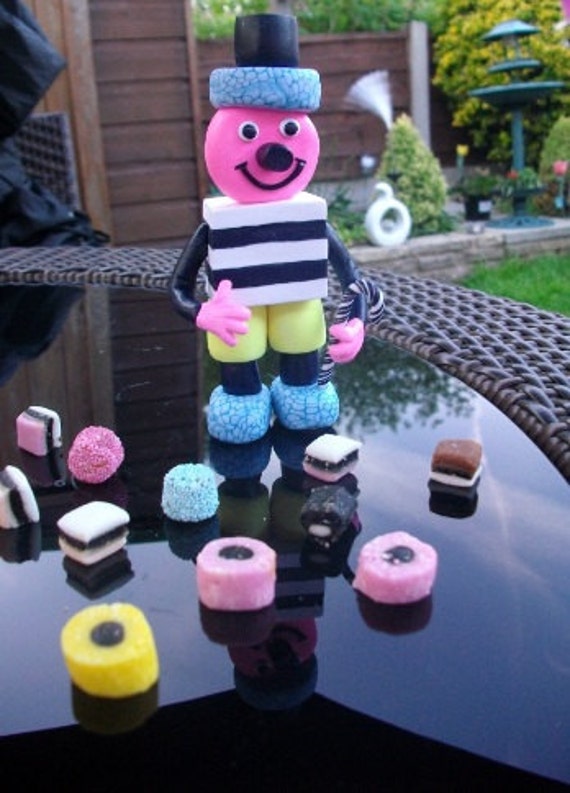 Quirky licorice allsorts candy figurine cake topper