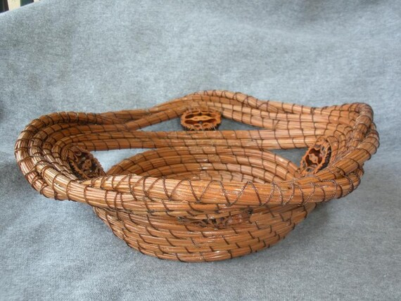 Longleaf pine needle basket with sliced black walnut shells.