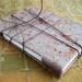 Handmade banana peel and onion skin paper covered journal with cord closure. Hand bound with sketch paper.