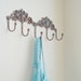 Wall hanger hook antiqued