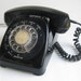 Black telephone - rotary style made in Canada- works- ring sound like in MAD MEN