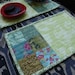 Green floral mug rugs