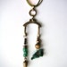 avant garde assemblage balancing lavalier necklace old typewriter part rustic turquoise brass and wood