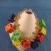 Gold Link Bracelet with Gold Ball Dangles & Hard Rubber Multi-Color Dice Charms
