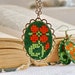 Cross stitch jewelry set - necklace and earrings with orange flower in bronze