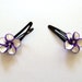 Purple and white flower barrettes