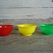 12 vintage Gem tiny plastic bowls in primary colors