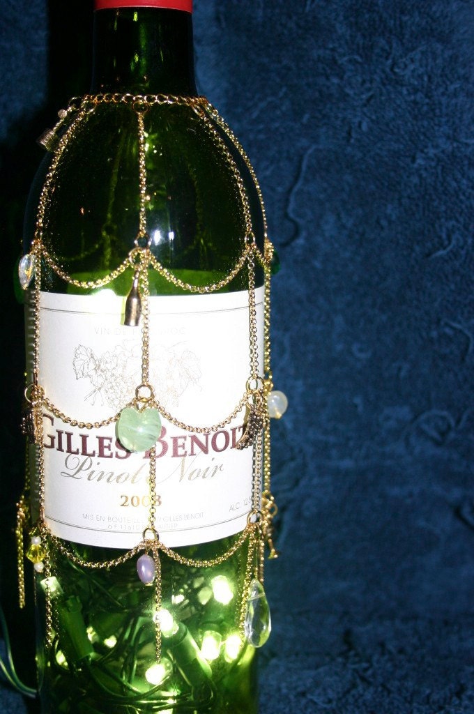 lighted wine bottle with gold decorative jewelry
