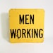Men Working Sign