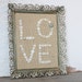 Buttons and Burlap in Vintage Weathered Filigree Frame - Love