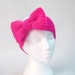 Neon pink bow headband knitted retro 80s style hair bows chunky ear warmers hairband with huge bow