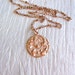 Rose gold necklace, round thistle pendant
