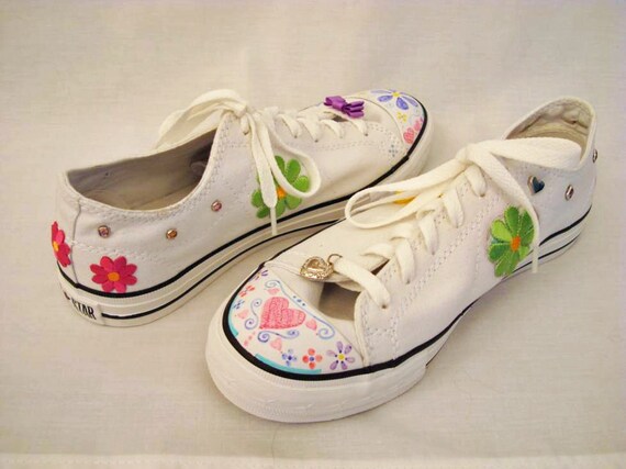 white sneakers with flowers on them