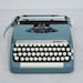 Blue Sterling Smith Corona Typewriter