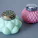 Pair of Pink and Jadeite Green Consolidated Glass Shakers