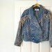 1980s Vintage Wanted Dead or Alive Acid Wash Denim and Fringe Jacket