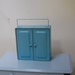 Vintage blue metal storage cabinet