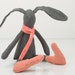 Gray wool small rabbit in peach with pink dots scarf and striped socks - handmade fabric doll