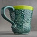Curvy Dottie Mug: Peacock Green Neon Green Curvy Dottie Mug by Symmetrical Pottery