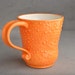 Curvy Dottie Mug: Orange and White Curvy Dottie Mug by Symmetrical Pottery