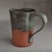 Red Clay Mug: Dark Green and Black Drippy Glaze Mug by Symmetrical Pottery