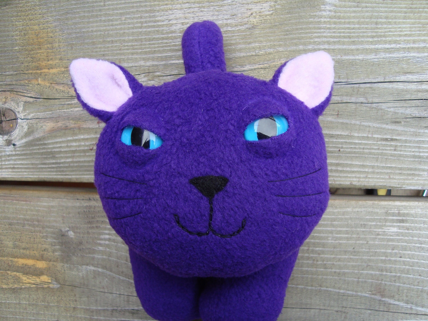 purple stuffed animal cat