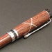 Cocobolo Platinum Twist Pen with White Celtic Knot