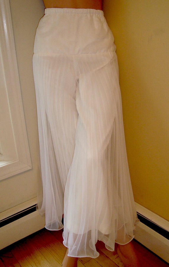 white pleated palazzo pants