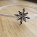 sparkly silver snowflake on skinny white stretchy headband