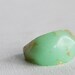 mint eco resin pebble shaped ring size 6.5 with suspended gold leaf
