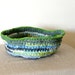 Upcycled fabric scraps deep blue and green crochet basket with two handles