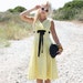 RESERVED for Meaghan VTG 50s Bombshell Yellow Empire Waist Party Dress w/ Black Bow XS