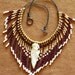 PRICE REDUCED Native American style fringed beaded necklace in gold, chocolate brown and pearly white with stone arrowhead